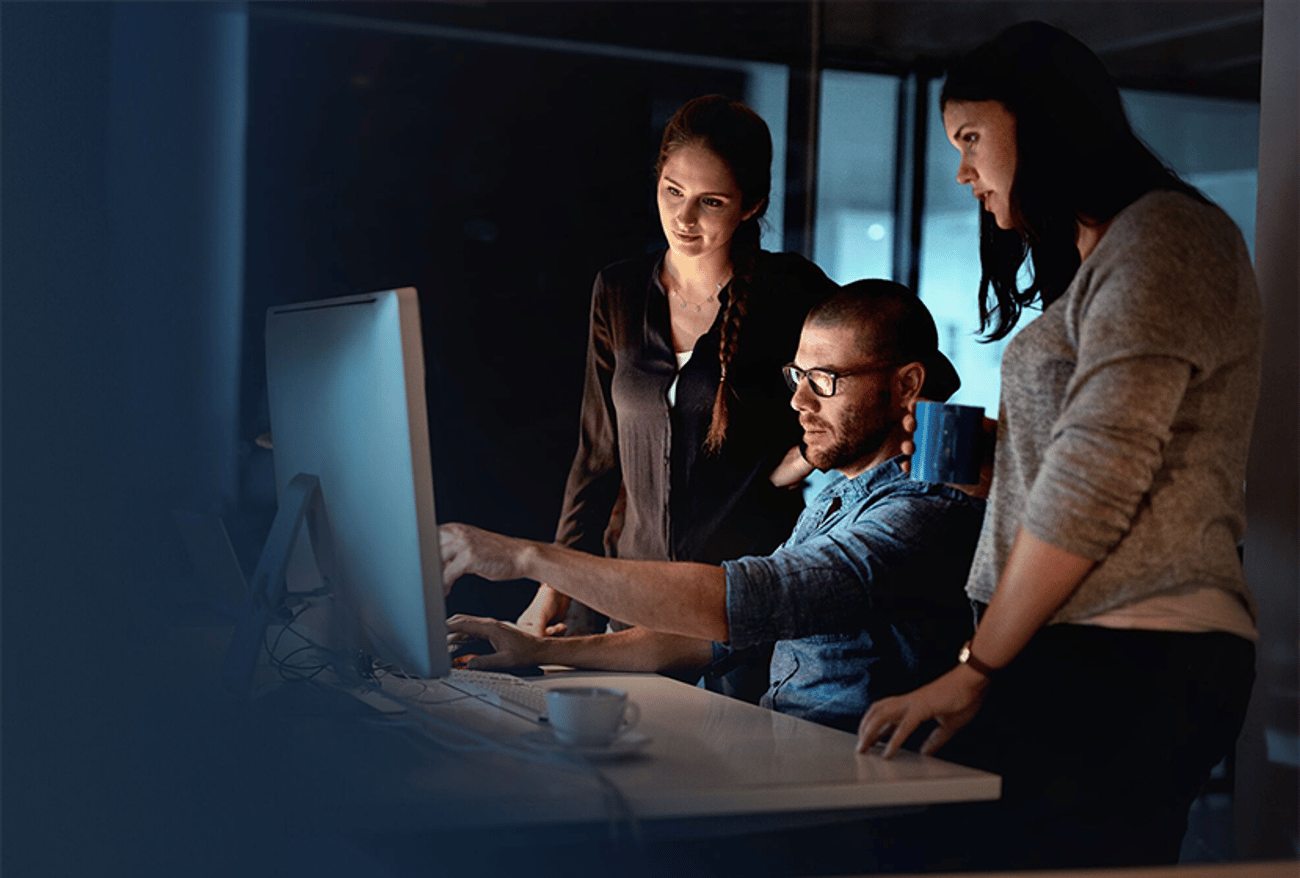Close-up of team that reviews documents on a computer