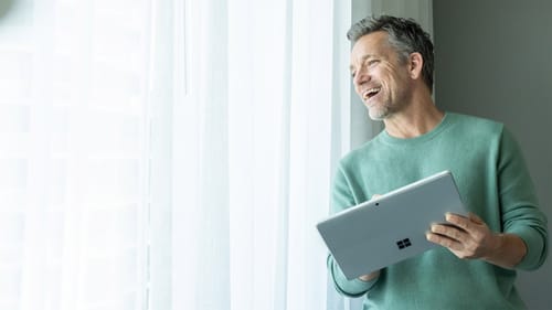 man working with laptop at home