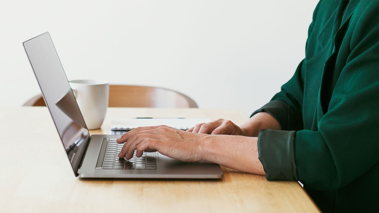 woman using laptop at desk