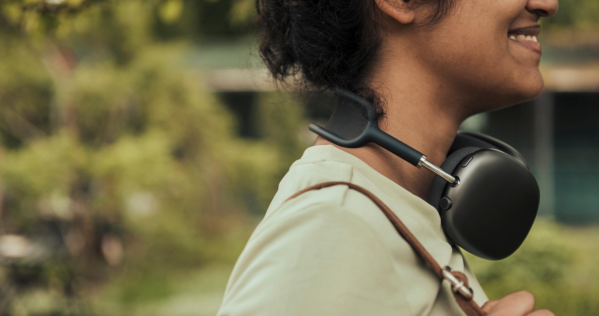 woman wearing apple headphones in a park during summertime