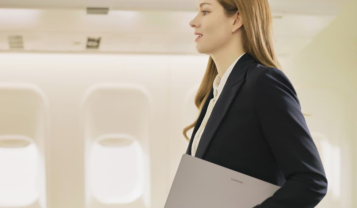 woman holding a samsung galaxy book